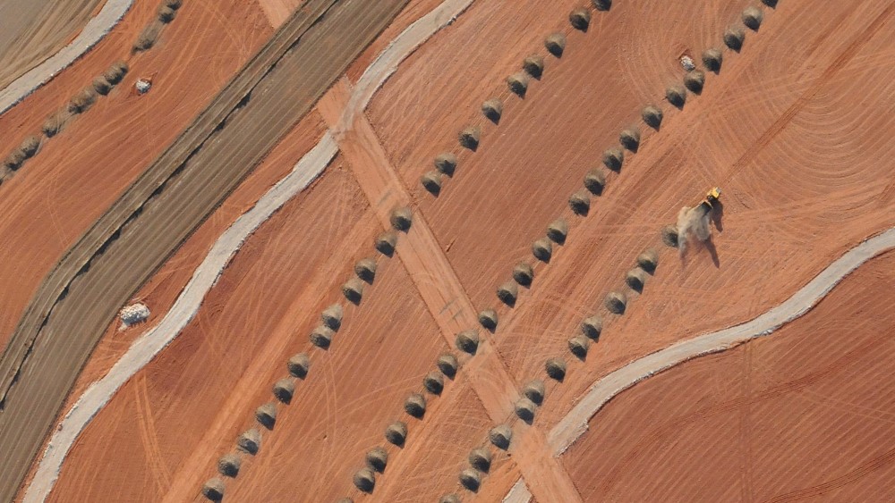 Aerial image of a dozer spreading soil as a mine closure activity