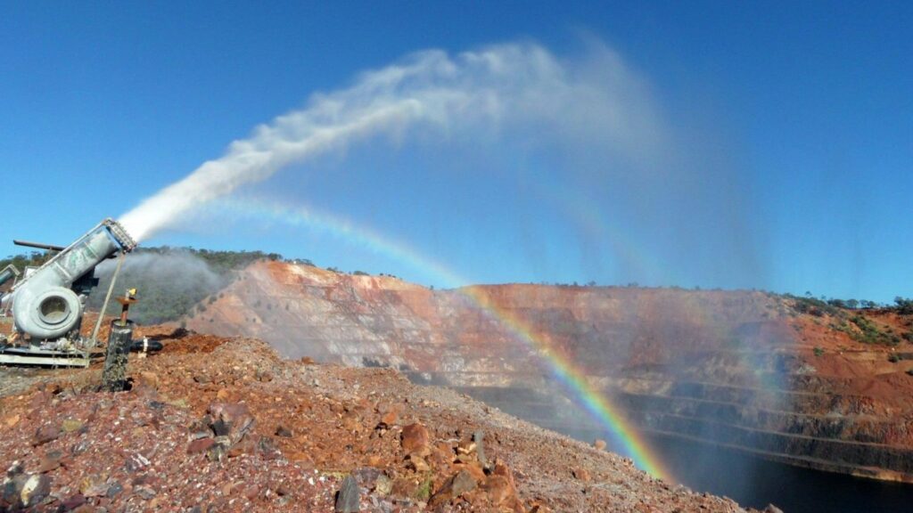 Mine pit water discharge (could be subject to ecological risk assessment) from a pump with a rainbow