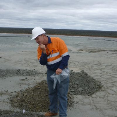 Lance contemplating during a soils, vegetation and tailings assessment